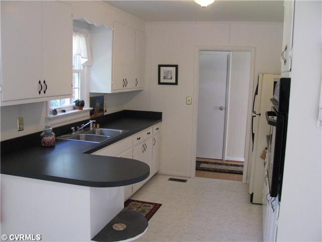 3337 Pleasants Road Powhatan, VA 23139 - Photo 5 of 10 Kitchen - Beautiful white kitchen with beautiful new counter tops, new sink and faucet, new oven and stove. Completely redone!