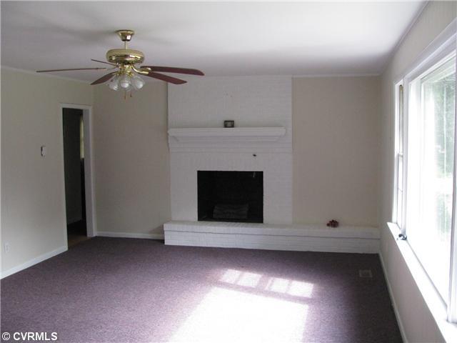 3337 Pleasants Road Powhatan, VA 23139 - Photo 7 of 10 Den/Family/Great Room - The spacious Family Room has a very large picture window bringing in lots of bright sunlight and a view of your beautiful private backyard! A wonderful wood burning fireplace is perfect for those long cold winter nights.
