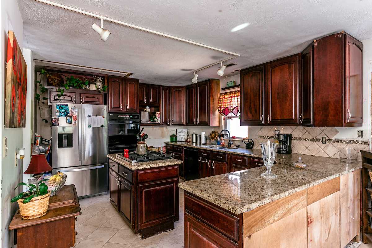136 Old Goose Crk Road Fishersville, VA 22939 - Photo 3 of 26 a kitchen with stainless steel appliances granite countertop a sink stove and refrigerator