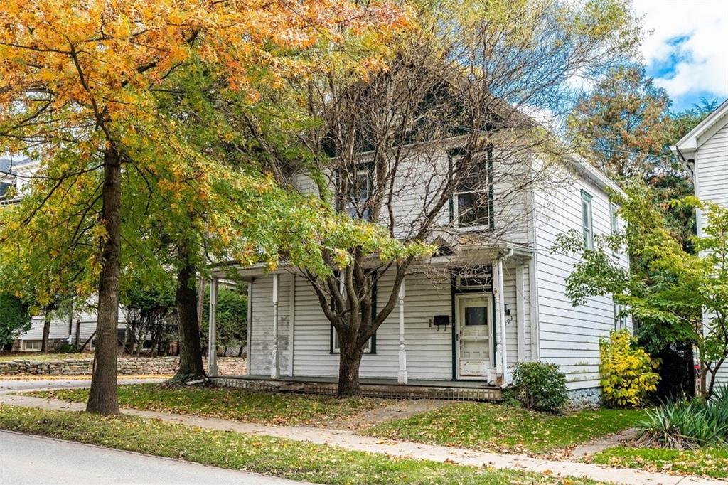 303 South 6th Street Indiana, PA 15701 - Photo 1 of 14 front view of a house with a tree