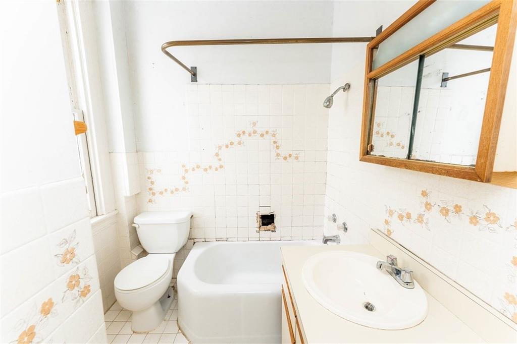 303 South 6th Street Indiana, PA 15701 - Photo 12 of 14 a bathroom with a sink and a mirror