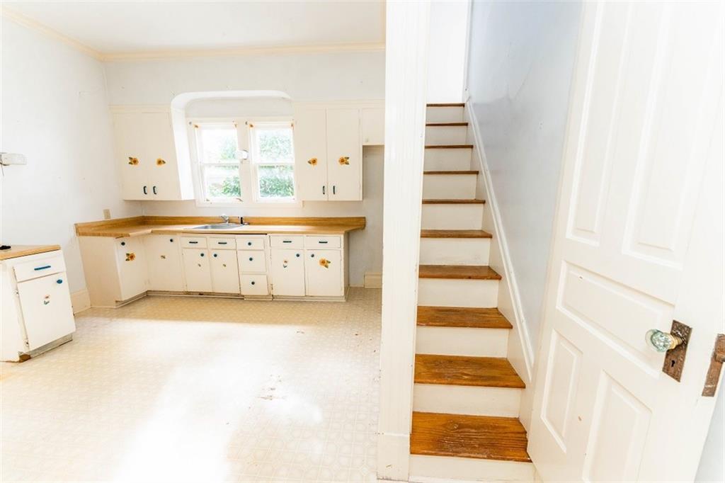 303 South 6th Street Indiana, PA 15701 - Photo 6 of 14 a view of a bedroom with wooden floor and entryway