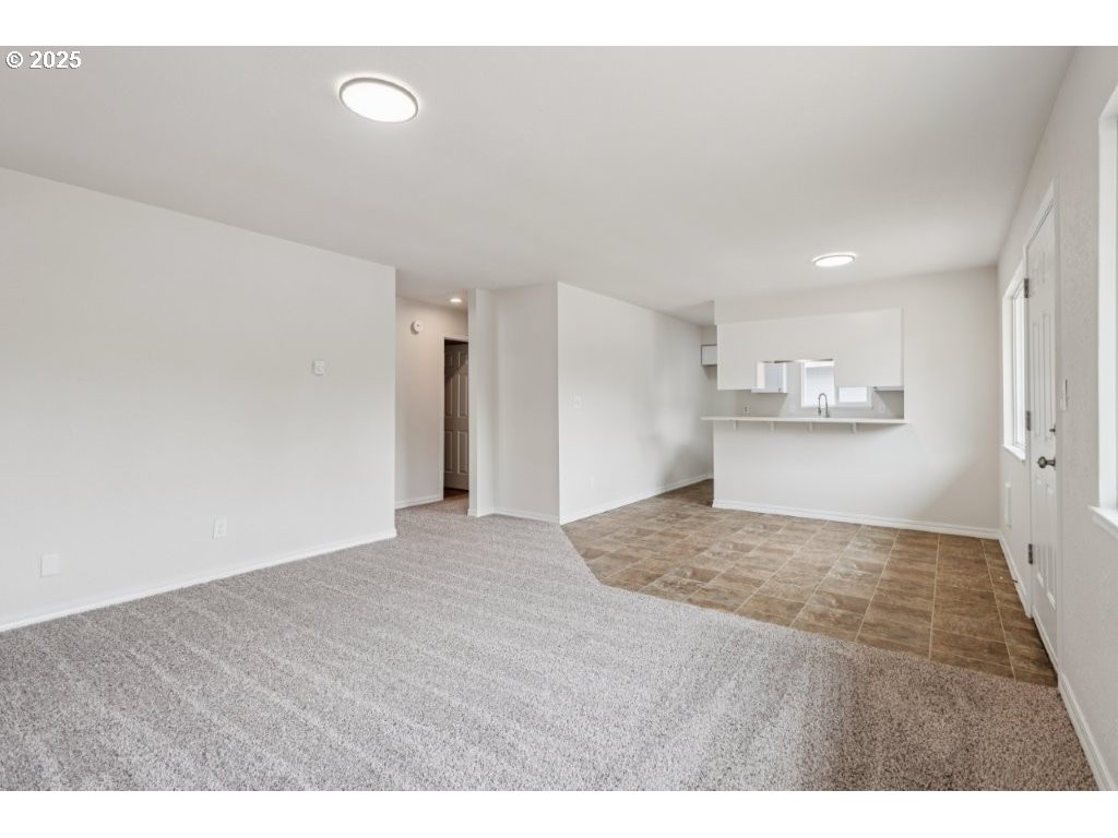 1500 Northeast Paropa Court Gresham, OR 97030 - Photo 11 of 31 a view of an empty room and kitchen