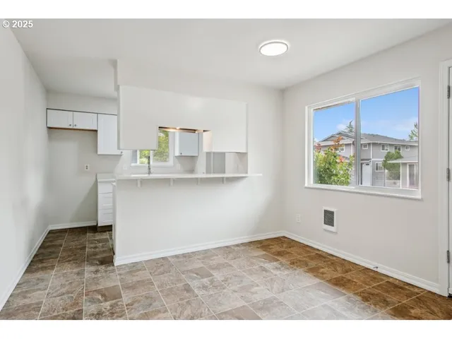 a view of a kitchen with a window