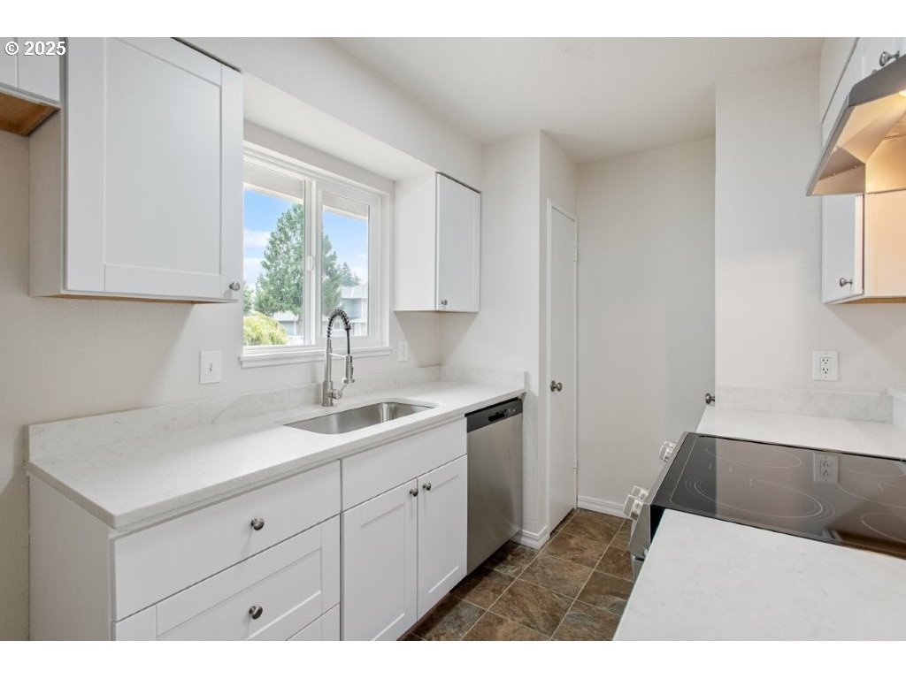1500 Northeast Paropa Court Gresham, OR 97030 - Photo 15 of 31 a kitchen with a sink cabinets and window