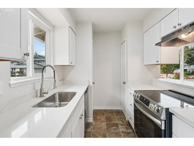 a kitchen with a stove and a microwave