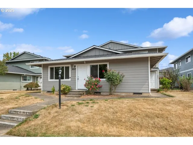 a house view with a garden space