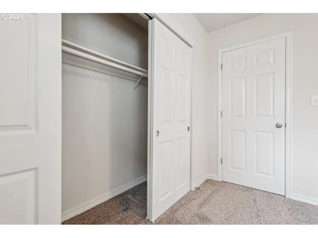 a bathroom with a sink toilet vanity and shower