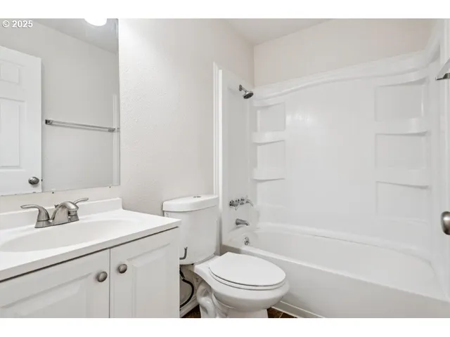a bathroom with a sink vanity and a mirror