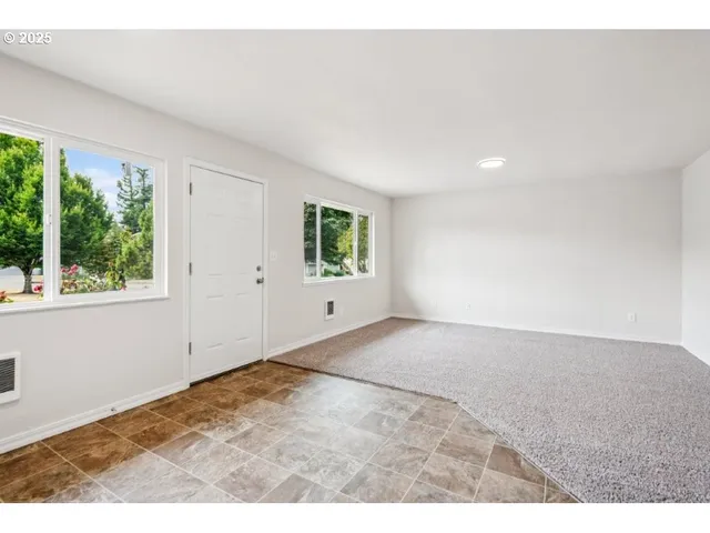 a view of an empty room and window