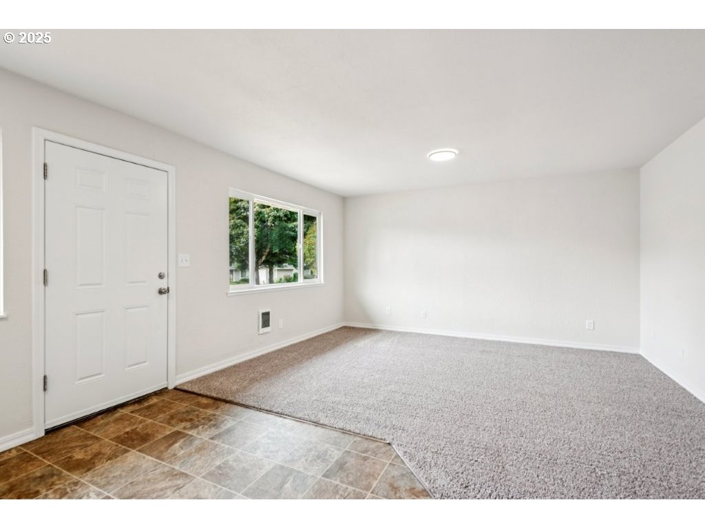 1500 Northeast Paropa Court Gresham, OR 97030 - Photo 5 of 31 a view of an empty room and window