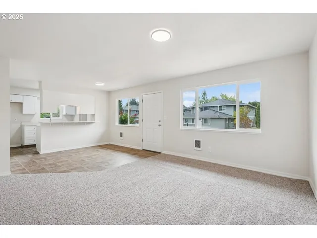 a view of a kitchen with a sink and cabinets