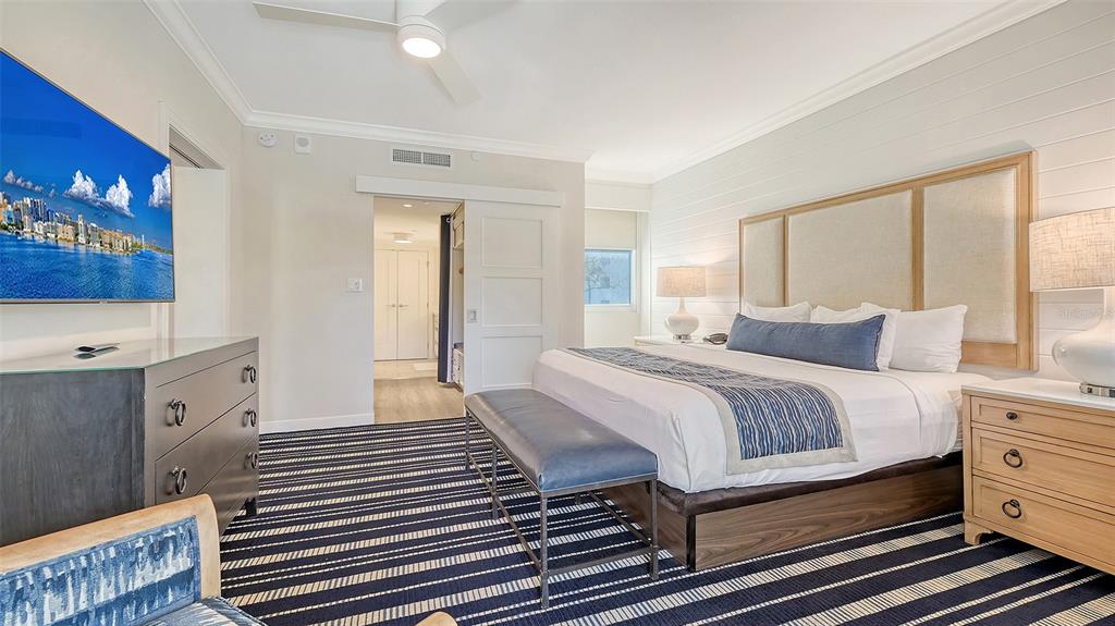 250 Sands Point Road, Unit 5101 Longboat Key, FL 34228 - Photo 16 of 42 a bedroom with a bed and a dresser