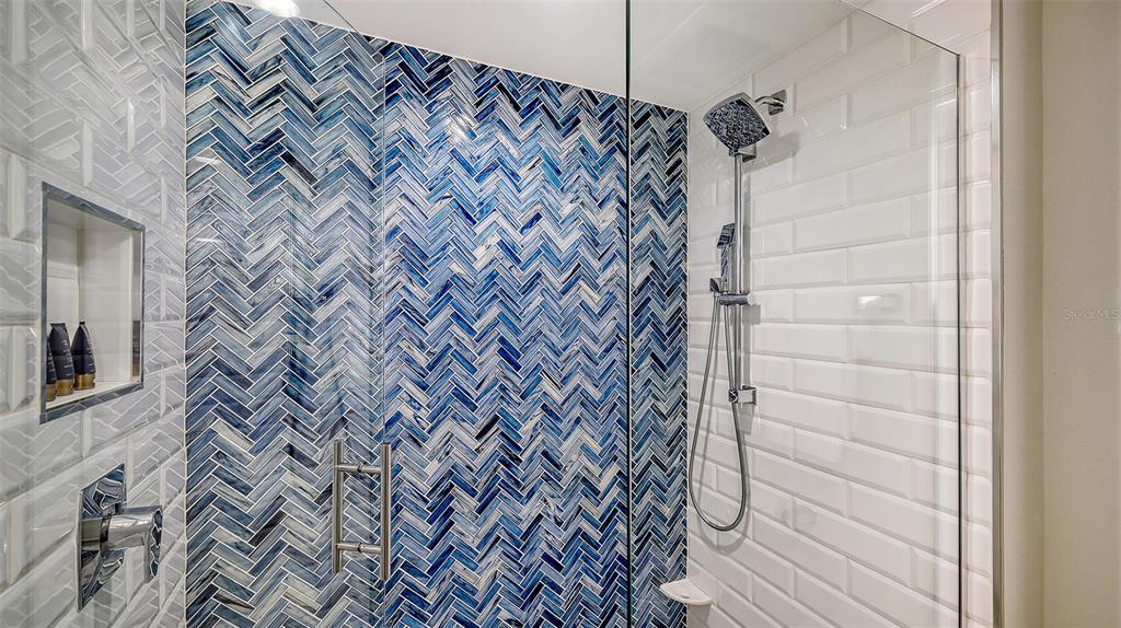 250 Sands Point Road, Unit 5101 Longboat Key, FL 34228 - Photo 20 of 42 a bathroom with a shower
