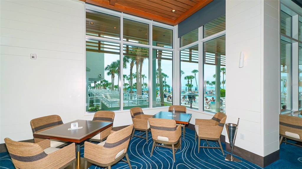 250 Sands Point Road, Unit 5101 Longboat Key, FL 34228 - Photo 36 of 42 a dining room with furniture and wooden floor