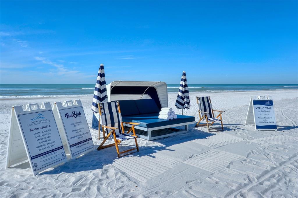 250 Sands Point Road, Unit 5101 Longboat Key, FL 34228 - Photo 41 of 42 a living room with furniture and a wooden floor