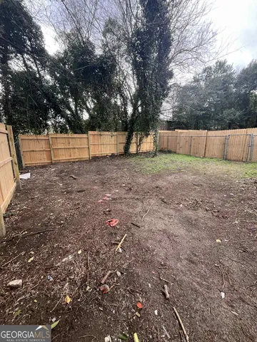 a view of backyard and tree