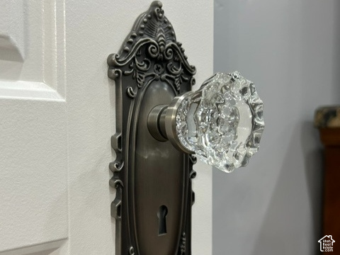 1750 West 4100 North Helper, UT 84526 - Photo 19 of 50 White paneled door featuring an ornate dark bronze escutcheon plate and a clear glass knob