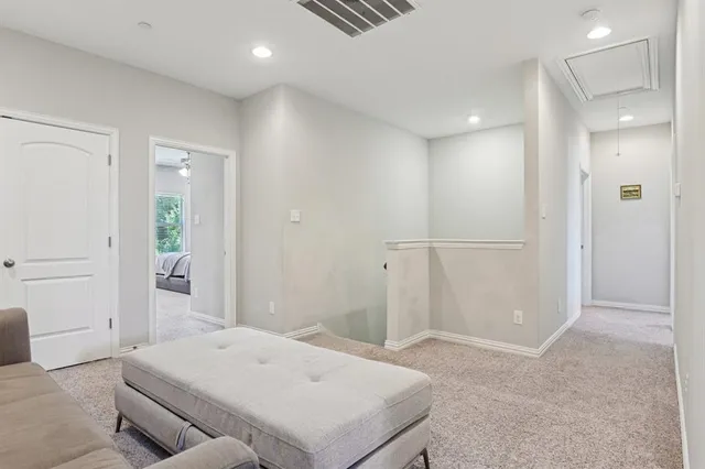 a bedroom with a bed and cabinets