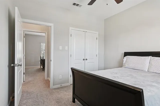 a room that has a bed and mirror