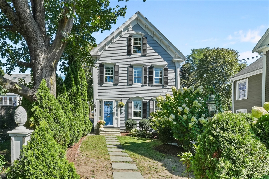 434 Main Street Amesbury, MA 01913 - Photo 1 of 40 a front view of a house with a yard