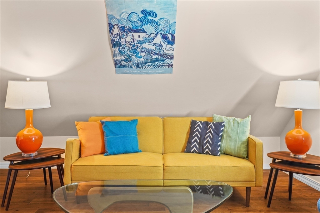 434 Main Street Amesbury, MA 01913 - Photo 22 of 40 a bedroom with a bed and a lamp on table