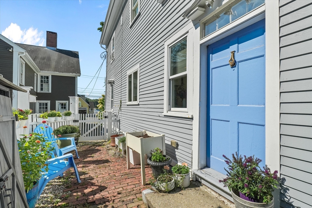 434 Main Street Amesbury, MA 01913 - Photo 24 of 40 a view of balcony with chairs and potted plants