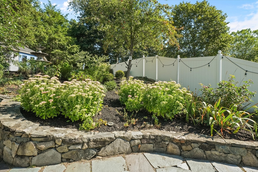 434 Main Street Amesbury, MA 01913 - Photo 29 of 40 a backyard of a house with lots of green space