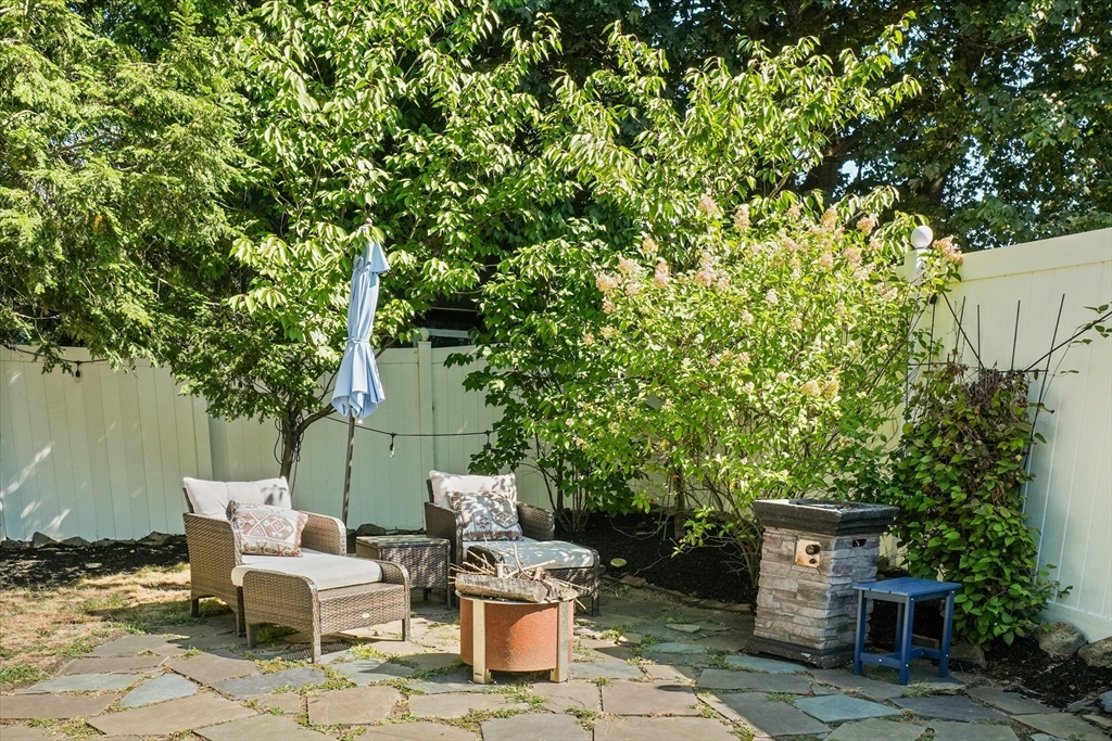 434 Main Street Amesbury, MA 01913 - Photo 30 of 40 a view of a patio with table and chairs and potted plants