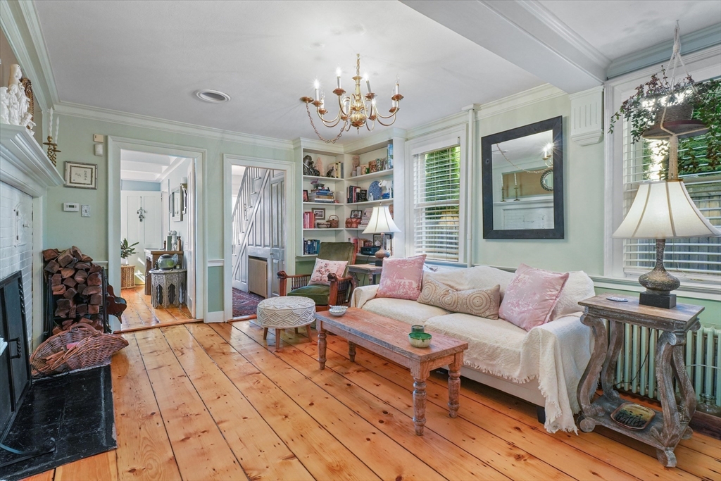 434 Main Street Amesbury, MA 01913 - Photo 4 of 40 a living room with furniture a chandelier and a large window