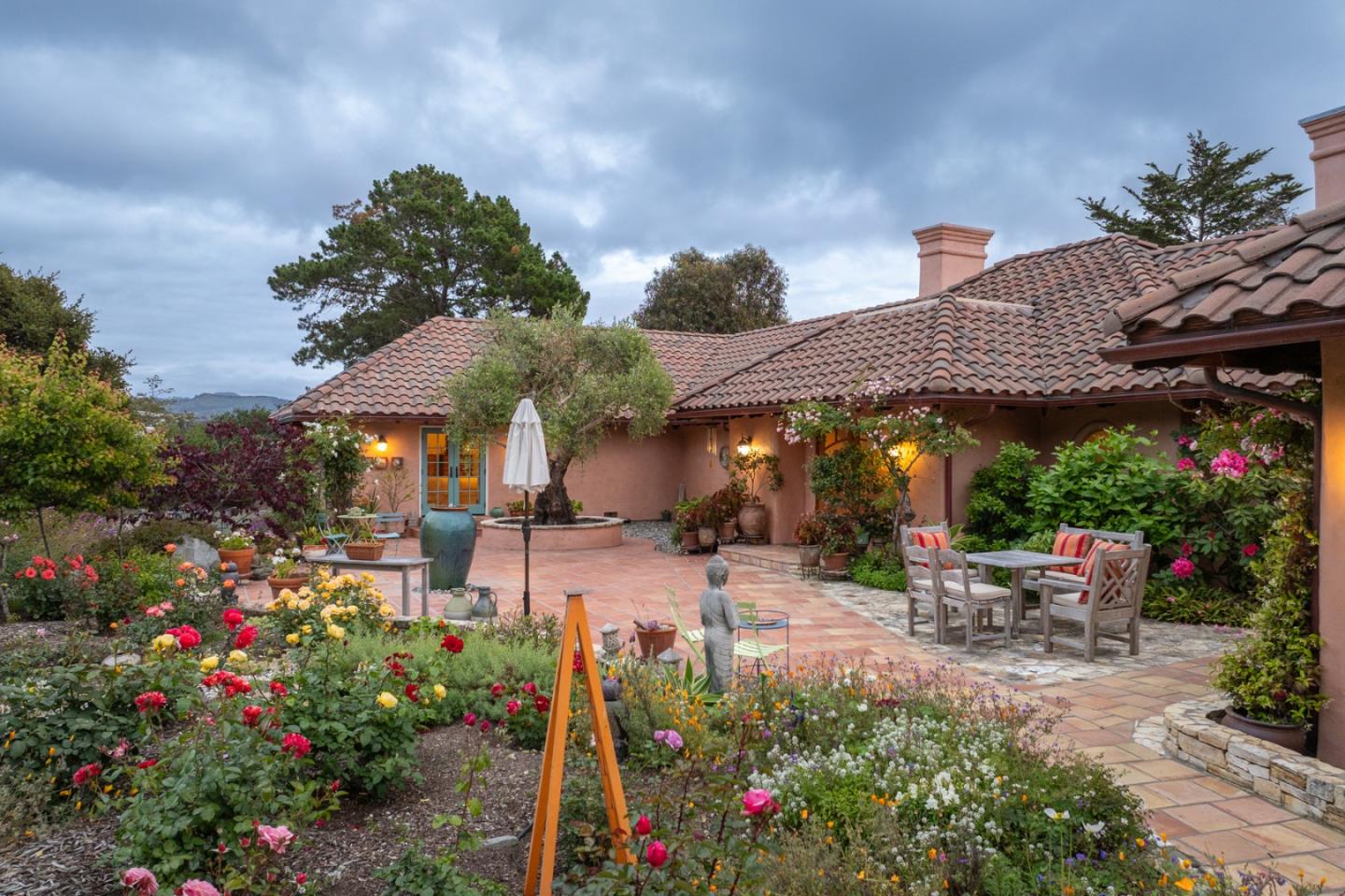 25987 Rio Vista Drive Carmel, CA 93923 - Photo 2 of 21 a view of a patio with table and chairs potted plants
