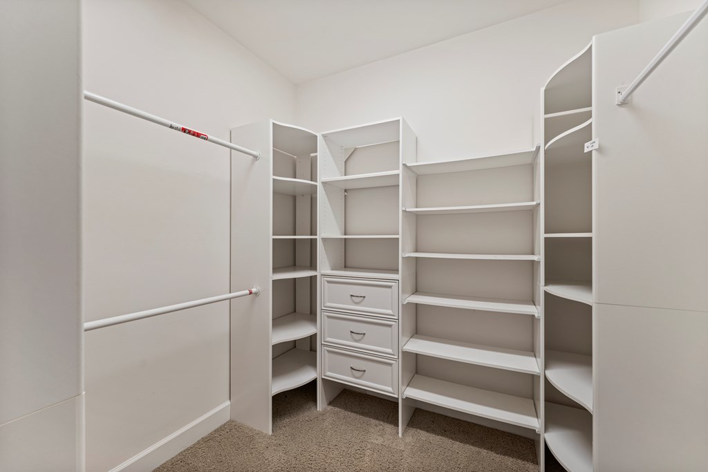 8848 Promenade Place Midland, GA 31820 - Photo 7 of 21 a view of walk in closet with empty racks