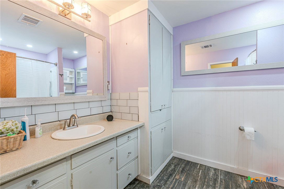 2411 Osage Road Gatesville, TX 76528 - Photo 15 of 26 Bathroom with extended vanity and mirror