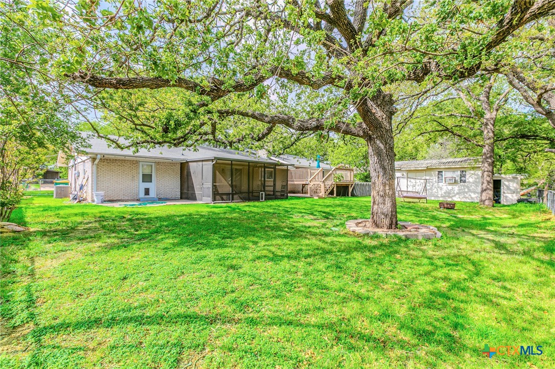 2411 Osage Road Gatesville, TX 76528 - Photo 22 of 26 Backyard with mature trees and open space