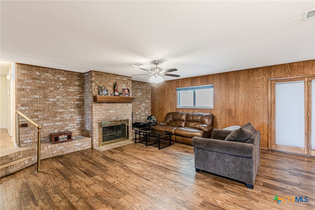 2411 Osage Road Gatesville, TX 76528 - Photo 5 of 26 Living area with fireplace and open concept layout