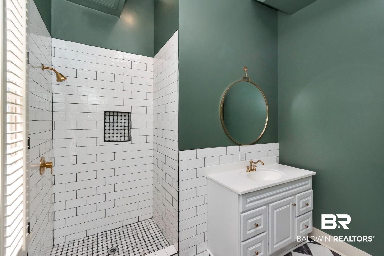 605 St Francis Street Mobile, AL 36602 - Photo 17 of 40 Full bathroom with vanity, backsplash, and a shower stall