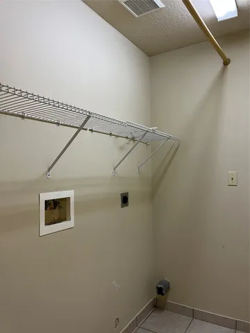 a view of a room with rack on the wall
