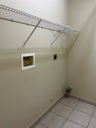 a view of a room with racks on the wall