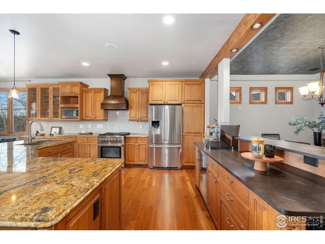 a kitchen with stainless steel appliances counter space a sink and cabinets