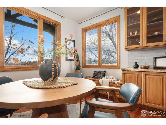 a dining room with furniture and window