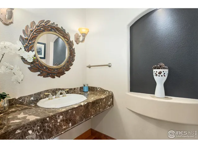 a bathroom with a sink a mirror and a toilet