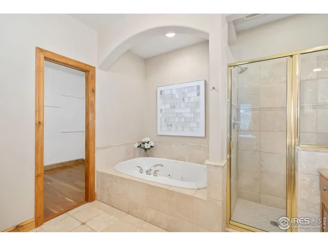 a bathroom with a tub and shower