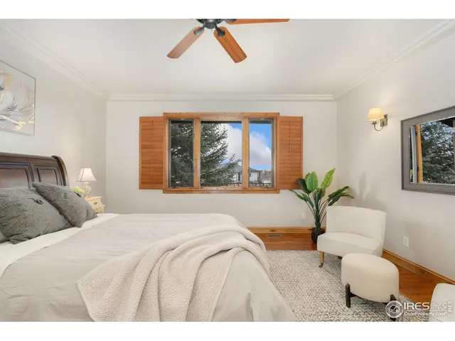 a bedroom with a large bed and a large window