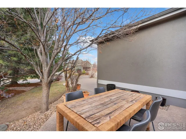 a view of a backyard with a table and chair