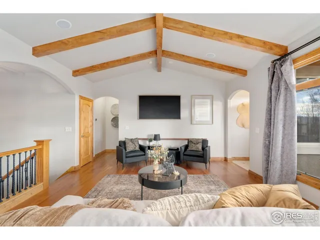 a view of a living room and a wooden floor