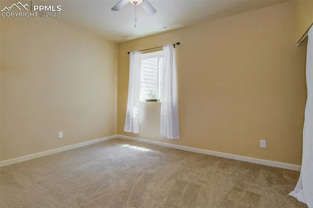 a view of a house with a yard and furniture
