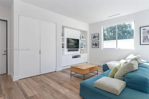 an aerial view of residential houses with city view