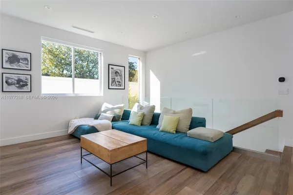 a living room with furniture and a window