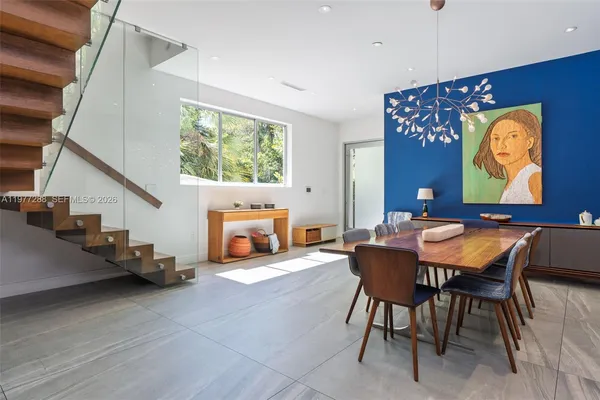 a view of a livingroom with furniture and entryway