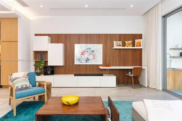 a living room with furniture and white walls